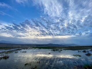 Hurricane Hilary brought beautiful clouds over the lake and reflections in Riverside, California