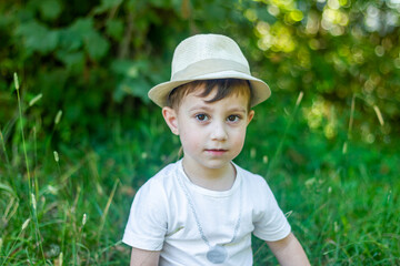 pretty boy in a hat, boy in the park