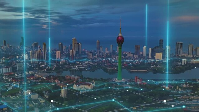 Aerial circular view of modern high rise buildings around famous Colombo Lotus Tower at dawn. Hyper lapse footage with computer added visual effects. Colombo, Sri Lanka