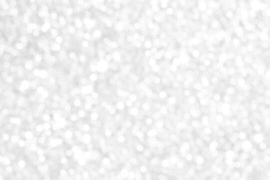 White and gray bokeh background. Photo can be used for the concepts of New Year, Christmas, Wedding Anniversary and all celebrations.