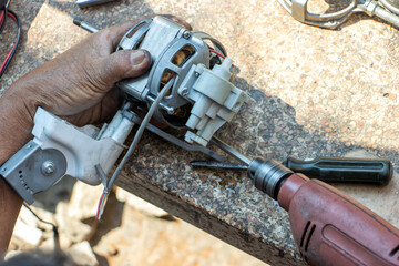 Repair of the fan at the garden table, close up