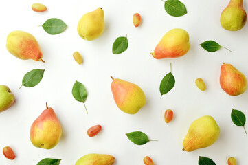 Light autumn background. Ripe yellow fragrant pears and grapes. Thanksgiving background. Fruits on a light background.