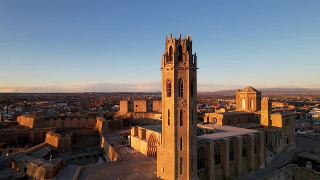 Panoramic aerial drone view of typical Gothic architecture La Seu Vella cathedral: vaults, colonnade, windows, arches of Cloister part Medieval Roman Catholic cathedral church de Santa Maria. 4K video