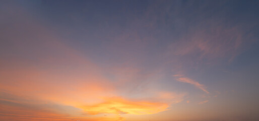 Sunset sky. Abstract nature background. Dramatic blue with orange colorful clouds in twilight time.