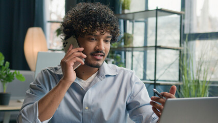 Smiling businessman call mobile phone talk cellphone conversation business discussion in office...