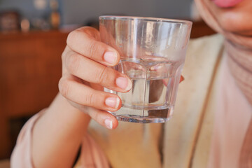 women holding a glass of water with copy space 