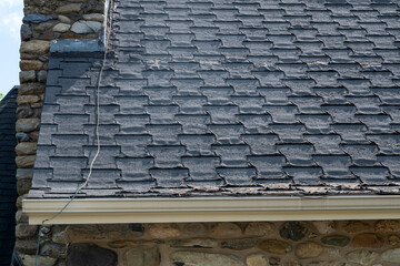 An old church damaged shingle roof