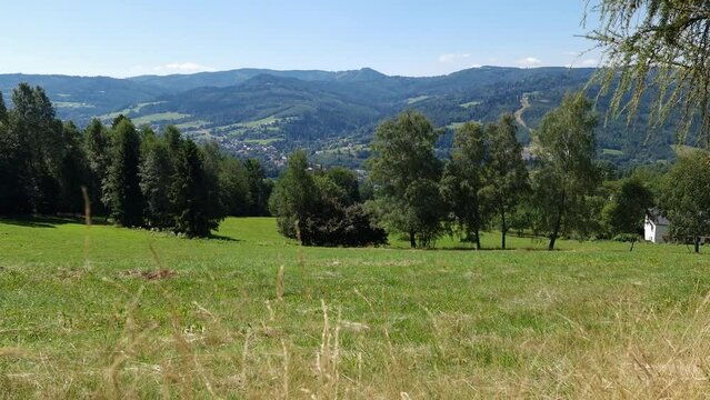 View on the Vistula valley and the peaks of Silesian Beskid on a sunny summer day.  tourist town Wisla, Poland