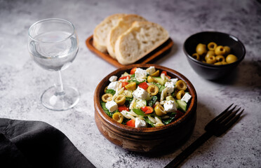 Spinach cucumber pepper orzo salad in a bowl