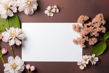 Fototapeta na wymiar Beautiful pink fresh flower with white blank card. Spring minimal concept. Invitation or greeting card mockup. Valentines day, Woman day. Flat lay, top view with copy space