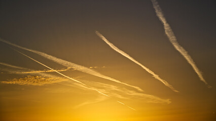 Jet trails during sunset, one often neglected form of environmental burden of air traffic.
