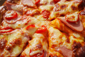 close-up. Pizza with ham, cheese and tomatoes. 
