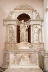  NAPLES, ITALY - APRIL 21, 2023: The side altar with the marble statue of Madonna, St. John the Baptist and St. Peter,  the church Chiesa di Sant'Anna dei Lombardi by by Girolamo Santacroce (1524). © Renáta Sedmáková