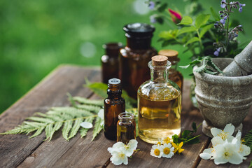 Apothecary concept, herbs and floral natural organic essential oils for wellbeing. Alternative medicine. Aromatherapy, pharmaceutical, preparation of homemade plant based cosmetic products.