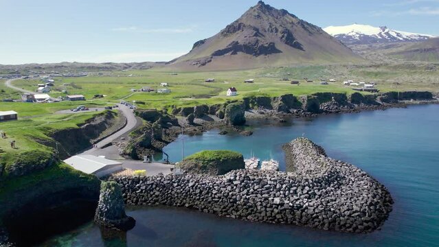 Arnastapi fishing village with white house and mount Stapafell on coastline in Snaefellsnes peninsula