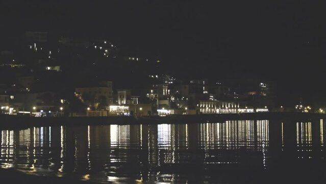 Sea resort port at night. Lights reflected in the water. Mallorca. Majorka. City Port Soller. Spain.