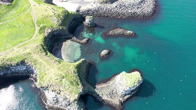 Arnastapi fishing village with white house and mount Stapafell on coastline in Snaefellsnes peninsula