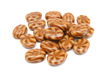 Caramel candies isolated on white background