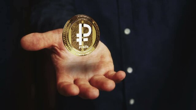 Digital Ruble RUB Cryptoruble cryptocurrency rotating 3d coin hovers over the hand. Businessman with symbol floating above the hand. Business and technology seamless and looped abstract concept.