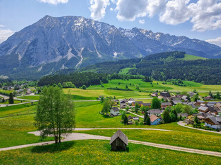 Summer austrian landscape with Grimming mountain (2.351 m), an isolated peak in the Dachstein...