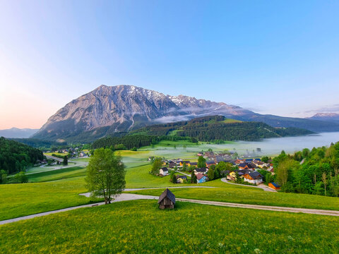 Summer austrian landscape with Grimming mountain (2.351 m), an isolated peak in the Dachstein Mountains, view from small alpine village Tauplitz, Styria, Austria