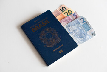 Brazilian passport with money, economic travel concept