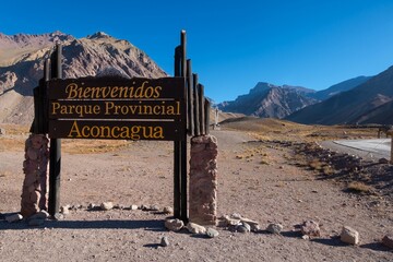 Welcome Wooden Board Post at Entrance to Mount Aconcagua Provincial Park.  Scenic Landscape View, Andes Mountain Range, Argentina