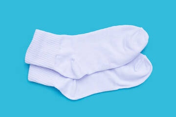White socks on blue background.