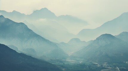 Fototapeta premium mountain range obscured by haze, showcasing the effects of air pollution generative ai