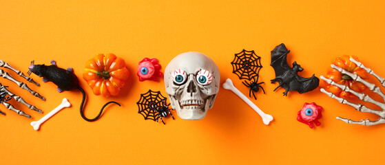 Happy Halloween banner. Top view skull, bones, bats, spiders, pumpkins with skeleton hands on...