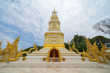 Obraz premium Wat Phrathat Phanom, Nakhon Phanom, Isan Temple. The pagoda is a buddhist temple in urban city town, Thailand. Thai architecture landscape background. Tourist attraction landmark.