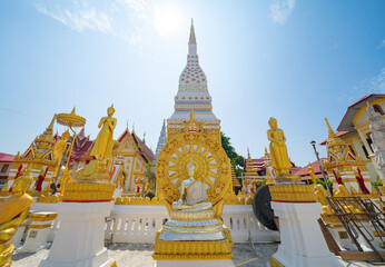 Fototapeta premium Wat Phrathat Phanom, Nakhon Phanom, Isan Temple. The pagoda is a buddhist temple in urban city town, Thailand. Thai architecture landscape background. Tourist attraction landmark.