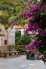 patio with flowers of an old monastery in Greece