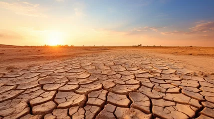 Fotobehang dry and cracked earth due to drought, a clear image of climate change generative ai © Kelly