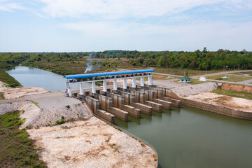Fototapeta na wymiar Aerial view of dam tower crane. Reservoir and sea water in recycle energy industry concept for electricity in Natural landscape background in Thailand. Environment.