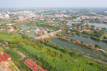 Obraz premium Aerial top view of a garden park with green forest trees, river, pond or lake. Nature landscape background, Thailand.