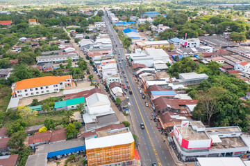 Aerial view of local residential neighborhood roofs. Urban housing development from above. Top view. Real estate in Isan urban city town, Thailand. Property real estate.