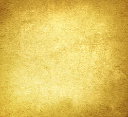 Golden textured surface as background, closeup view