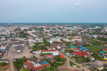 Obraz premium Aerial view of local residential neighborhood roofs. Urban housing development from above. Top view. Real estate in Isan urban city town, Thailand. Property real estate.