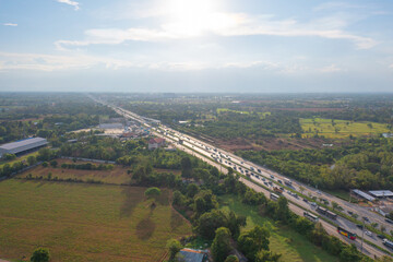 Aerial top view of fresh paddy rice, green agricultural fields in countryside or rural area in Asia, Thailand. Nature landscape