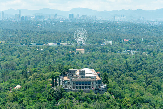 aerial view of chapultepec castle with the forest and the city in the background 