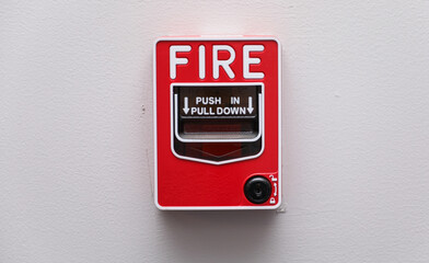 Vivid fire alarm, a symbol of urgency and safety, warns of danger, evoking preparedness and protection in emergencies. Red alert icon