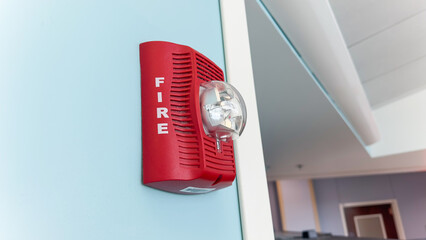 Vivid fire alarm, a symbol of urgency and safety, warns of danger, evoking preparedness and...