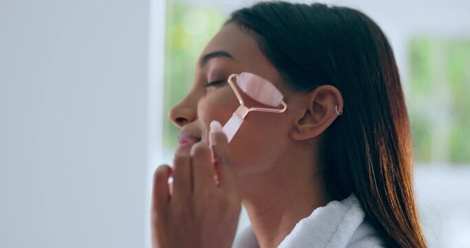 Face, skincare and woman with roller, beauty and morning routine, natural treatment and tools, massage and wellness. Soft skin, glow and cosmetics, dermatology and grooming at home with rose quartz
