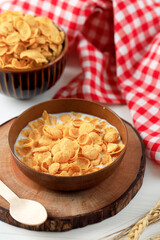 Corn Flakes with Fresh Milk in A Brown Bowl