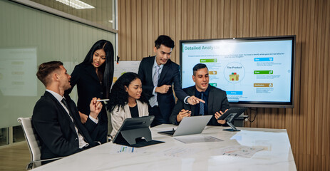 Diverse team innovates for sales KPIs via collaborative brainstorming to develop business models.