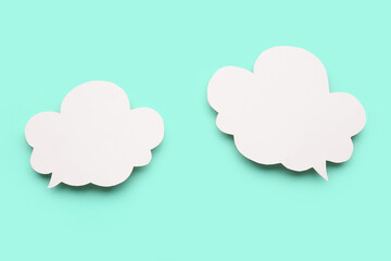 Blank speech bubbles on turquoise background