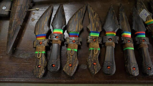 Admire the exquisite artistry of decorative wooden weapons made from chonta wood. This video provides a captivating close-up view of the intricate craftsmanship