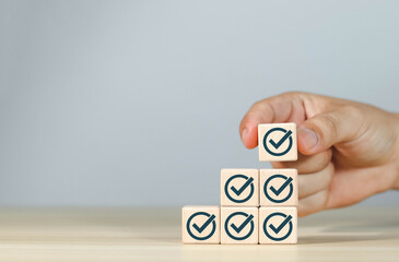Wooden blocks display markers to summarize the details of the work. Document checklist and online...