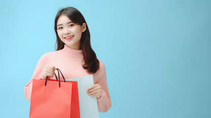 Fototapeta na wymiar woman holding shopping bag on pastel color background